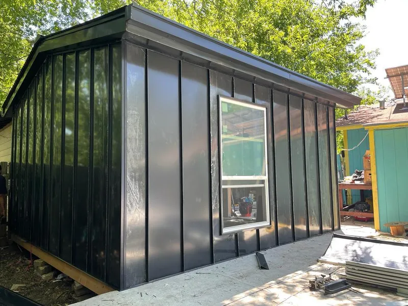 Black standing seam metal wall panels for Roof Inspection in East Buffalo