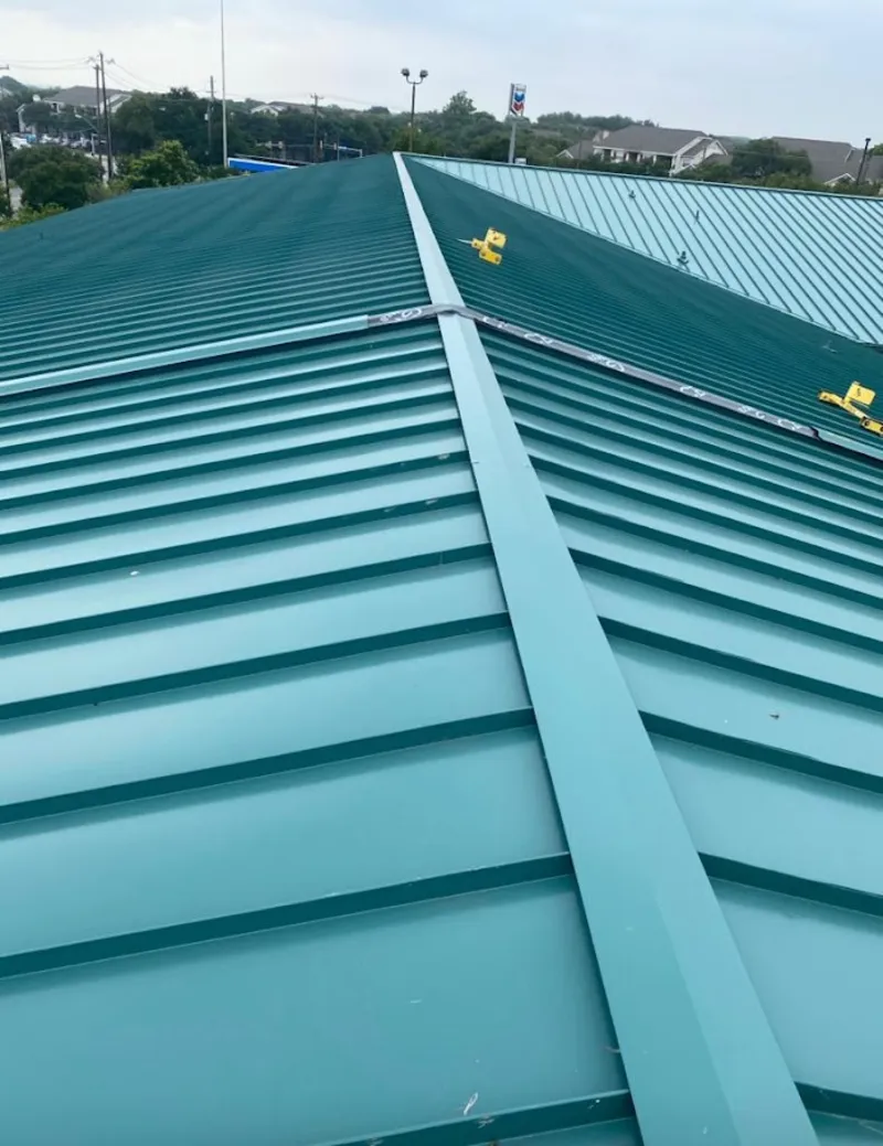 Green commercial metal roof ridge and valley for Metal Roof Repair in East Buffalo